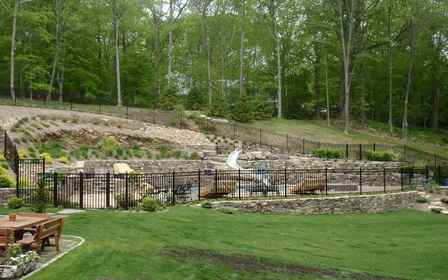 Fence project showing gate placement and finished pool perimeter